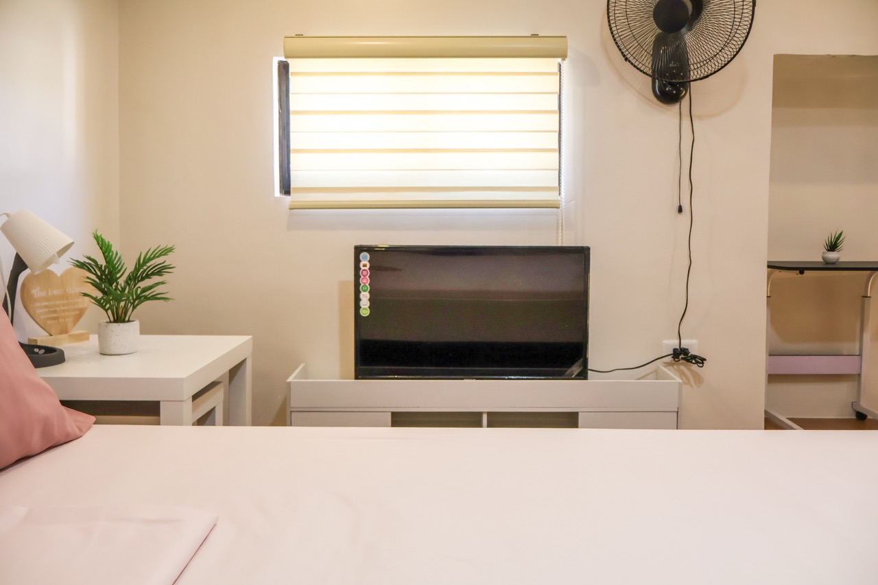 Bedroom with queen bed at HavenInLipa Cozy 1BR rental Lipa City