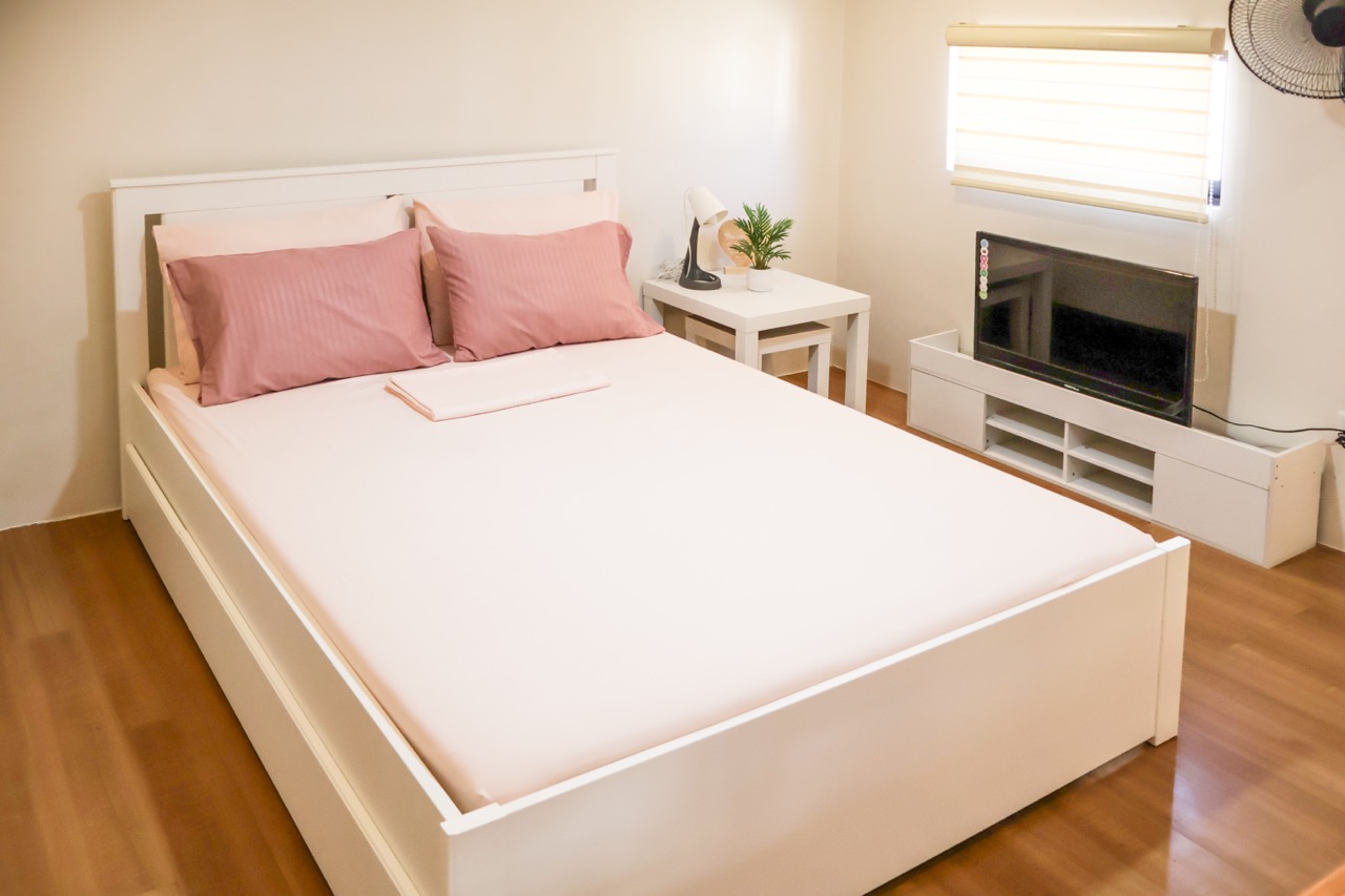 Master bedroom with queen bed and AC at HavenInLipa 2BR rental Lipa City