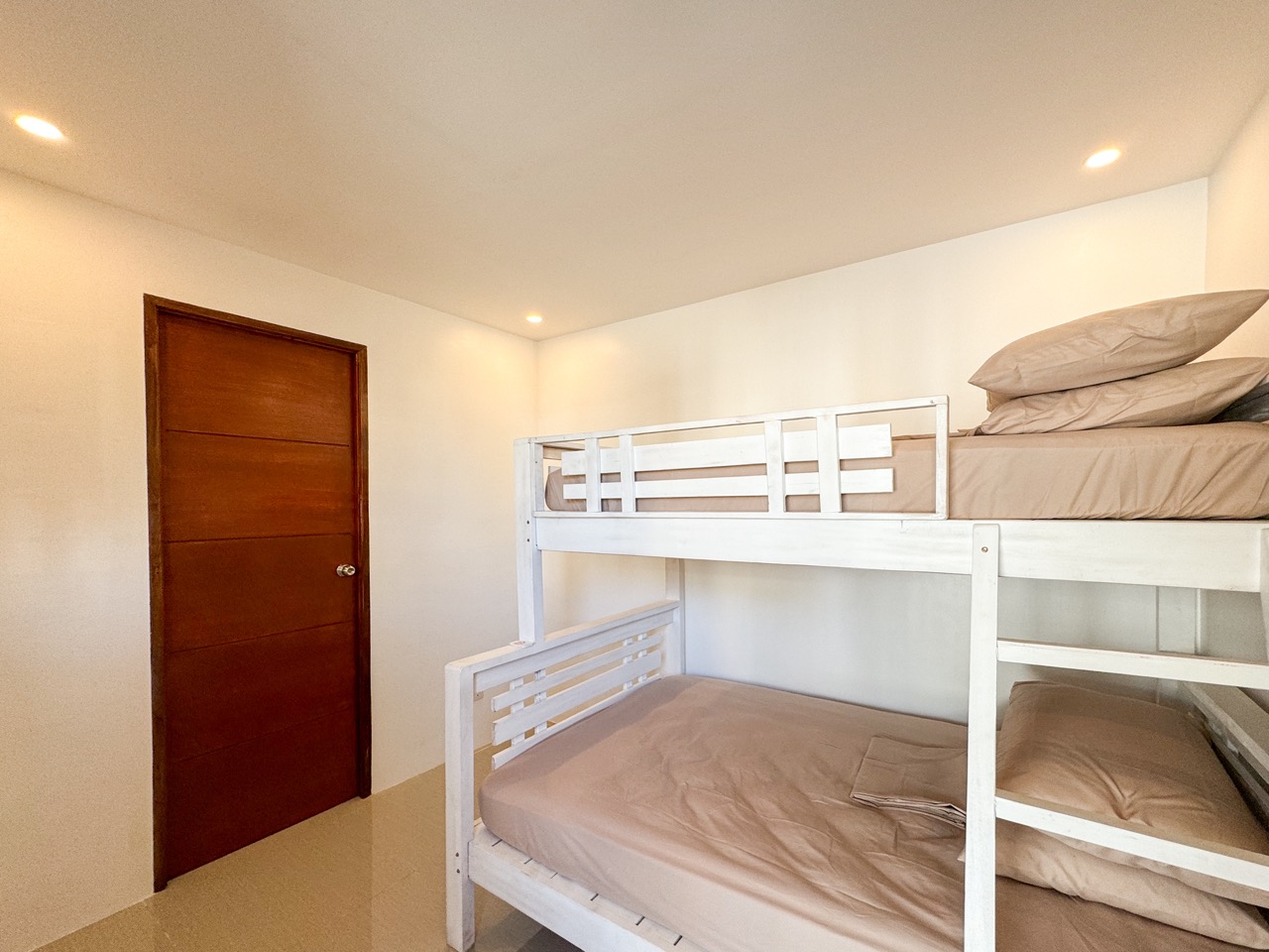 Full kitchen with stove fridge and cookware at HavenInLipa 2BR Lipa City rental